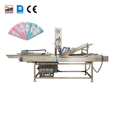 Dispositivo automatico per l'imbustamento di coni per elevati standard in ambienti industriali